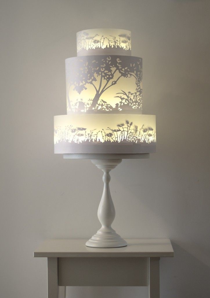 The glowing tiers of this wedding cake appear to be lit from within. Very clever painting by Rosalind Miller
