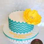 Teal Chevron Cake with Yellow Flower