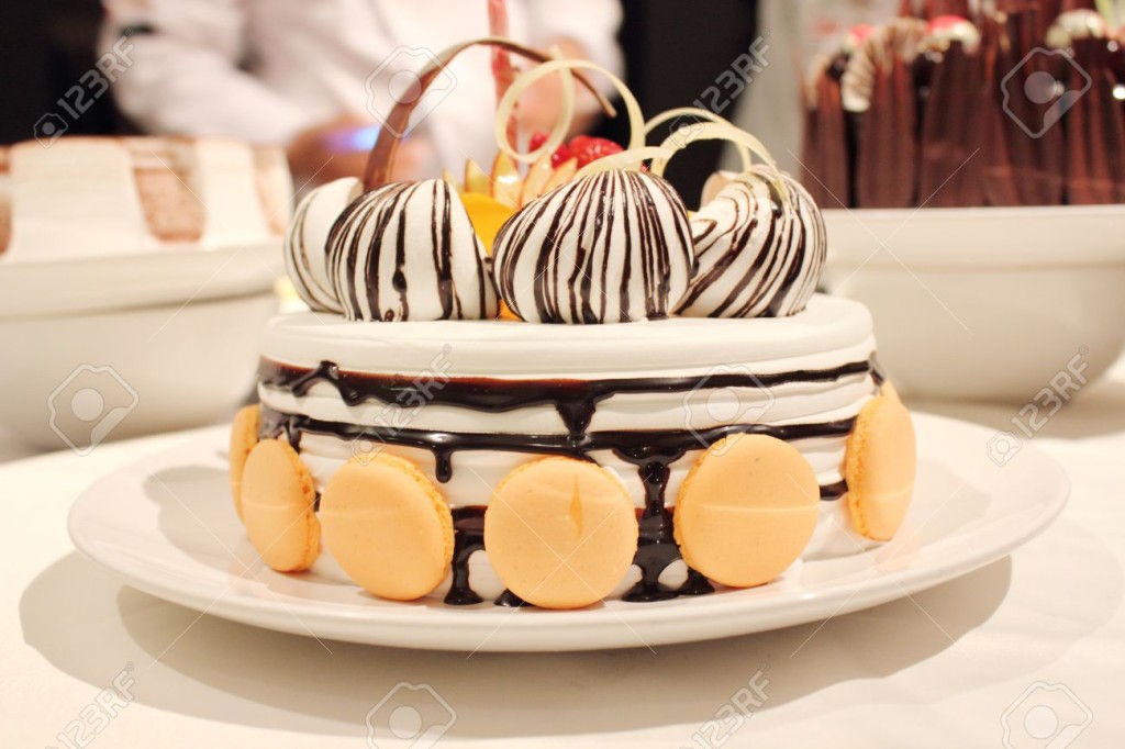 Beautiful Cake with Cream and Macaron