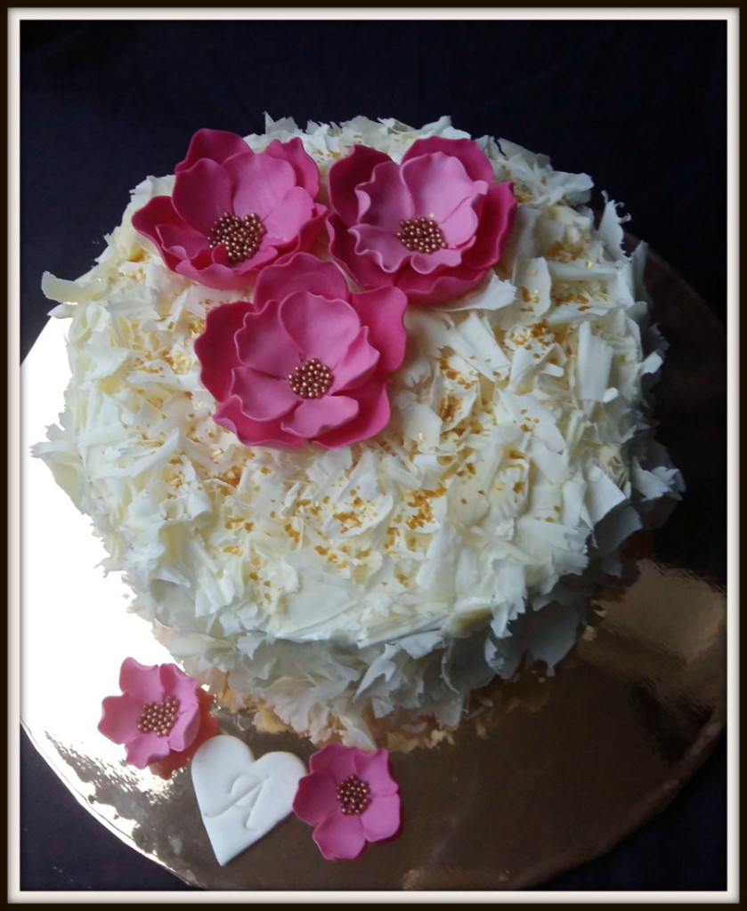 Cake Decorated with White Cholate and Fondant Flowers