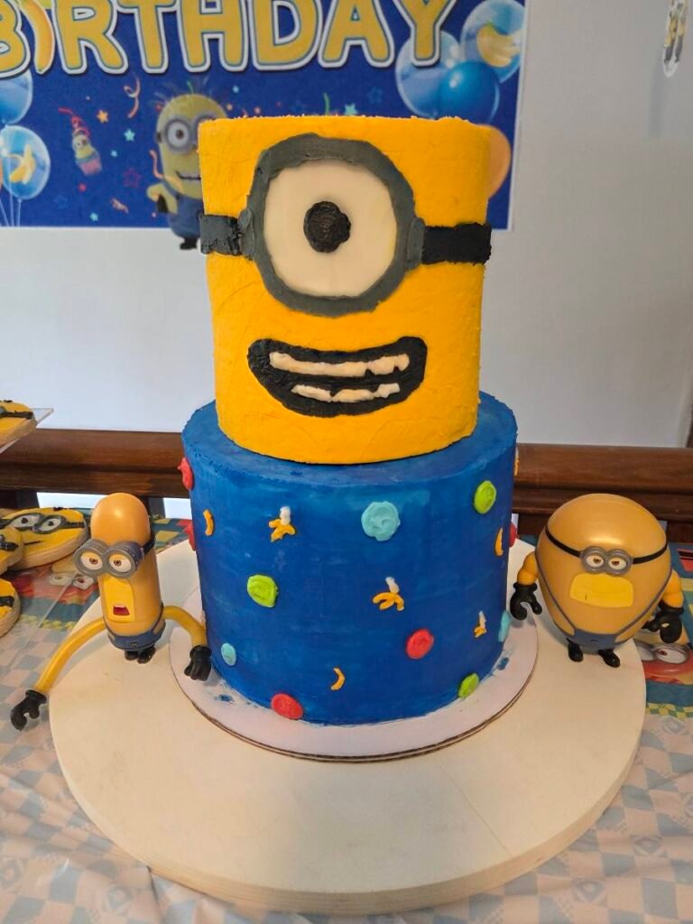 Minion Cake by KK's Sweets & Treats